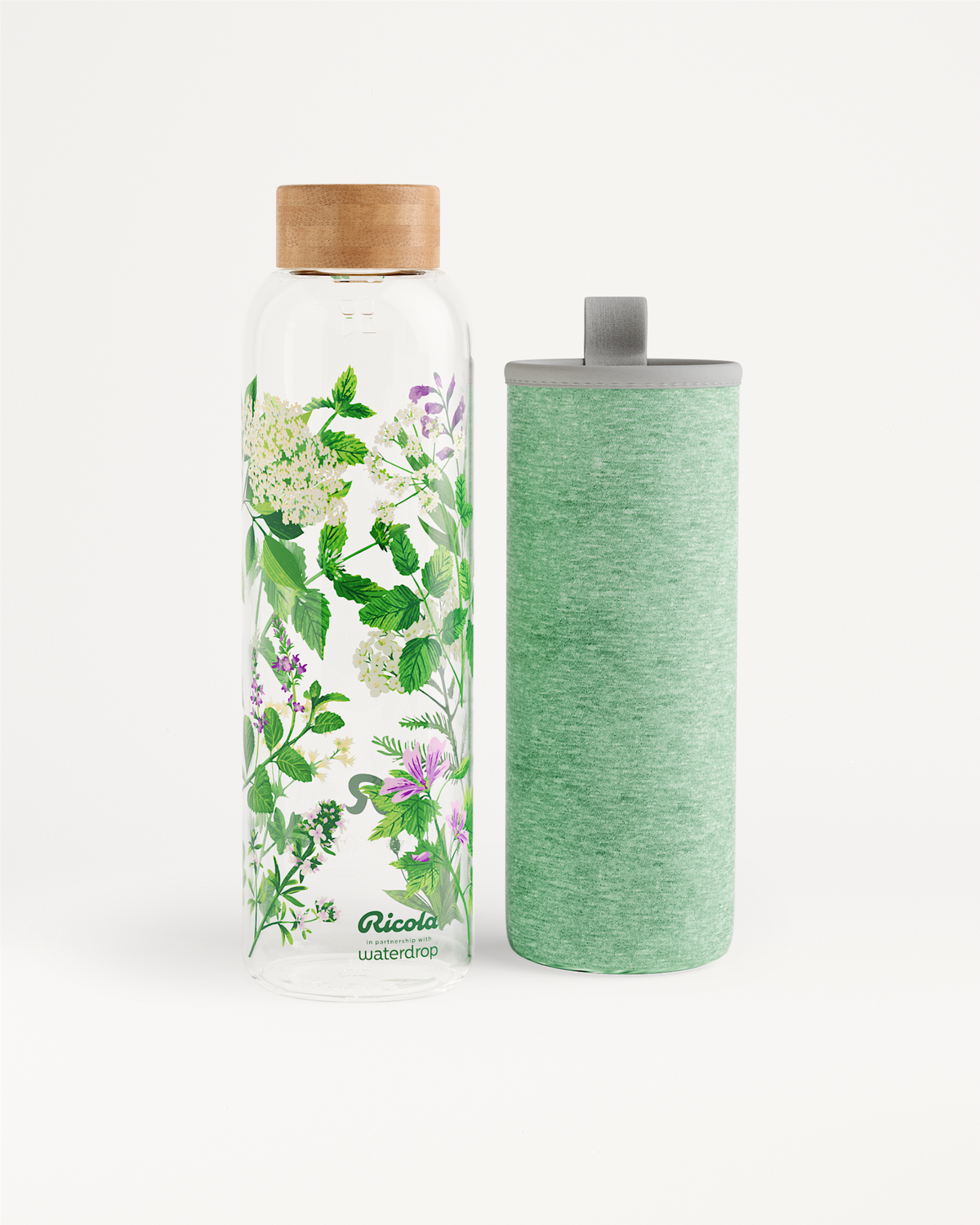 Ricola Edition Glass bottle with botanical design and sleeve.