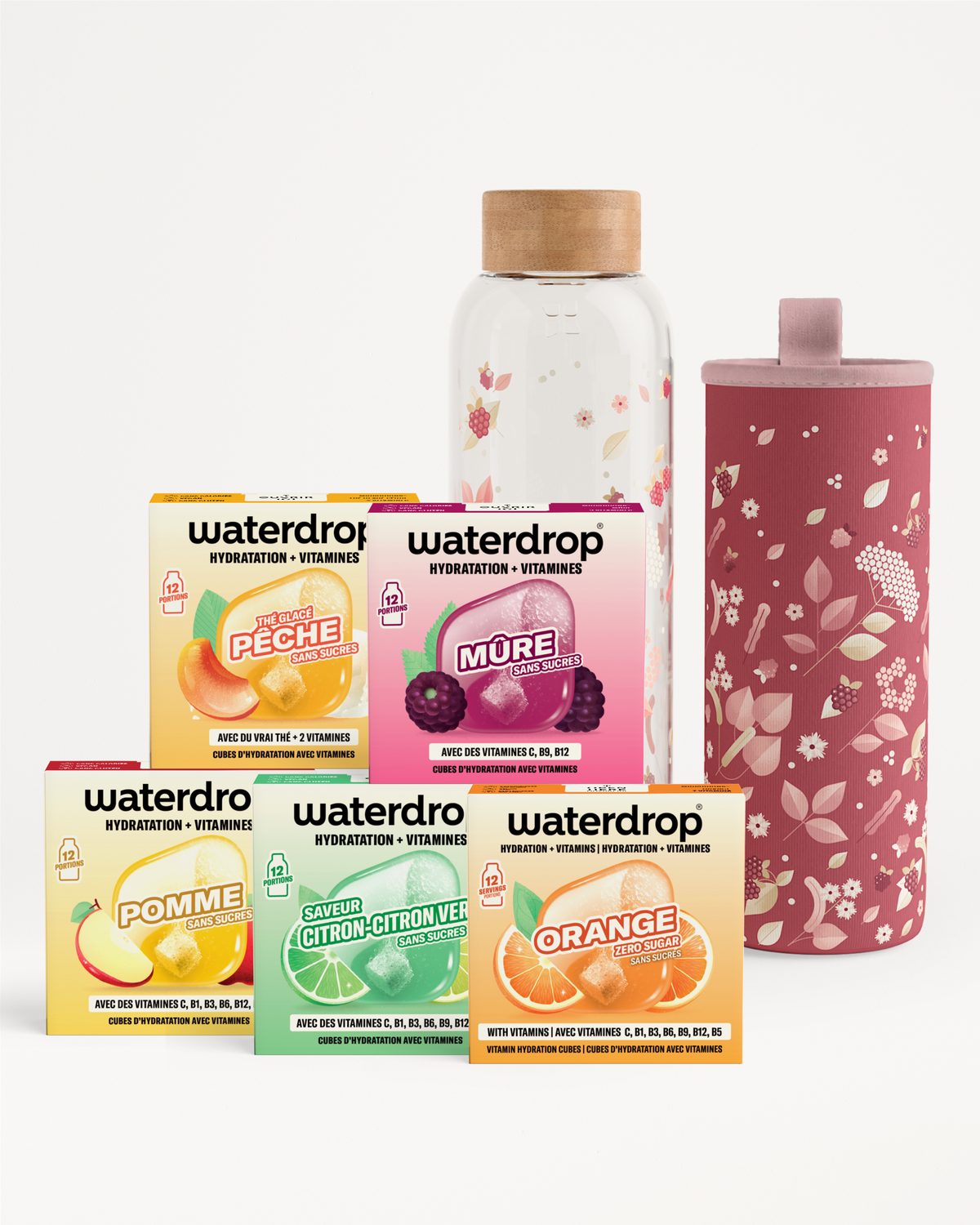 Assortiment de boîtes Waterdrop pour l'hydratation avec une bouteille en verre et un gobelet isolant rose.