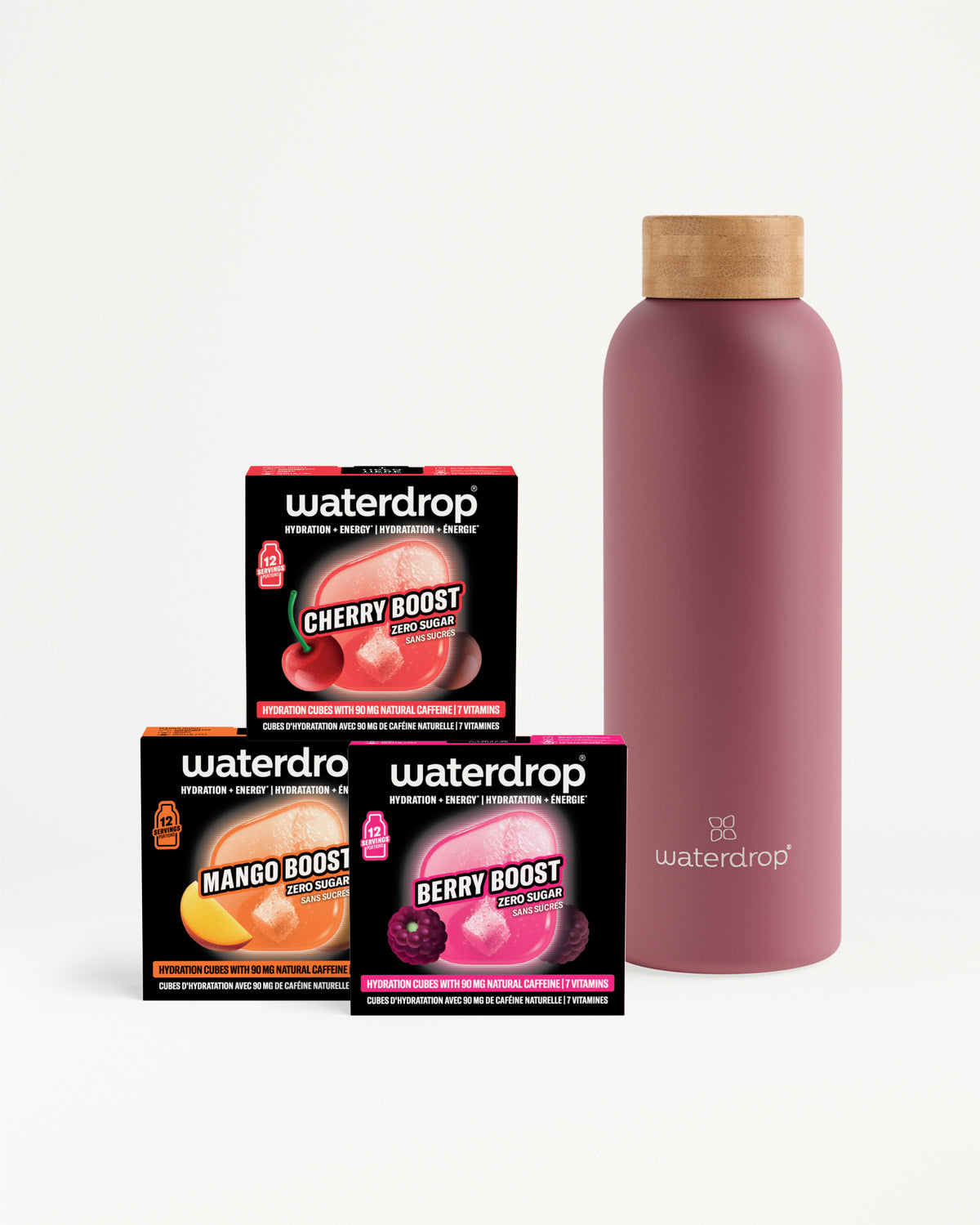 Trois boîtes compactes Waterdrop pour boosters de saveur à côté d'une bouteille rose réutilisable à capuchon en bois.