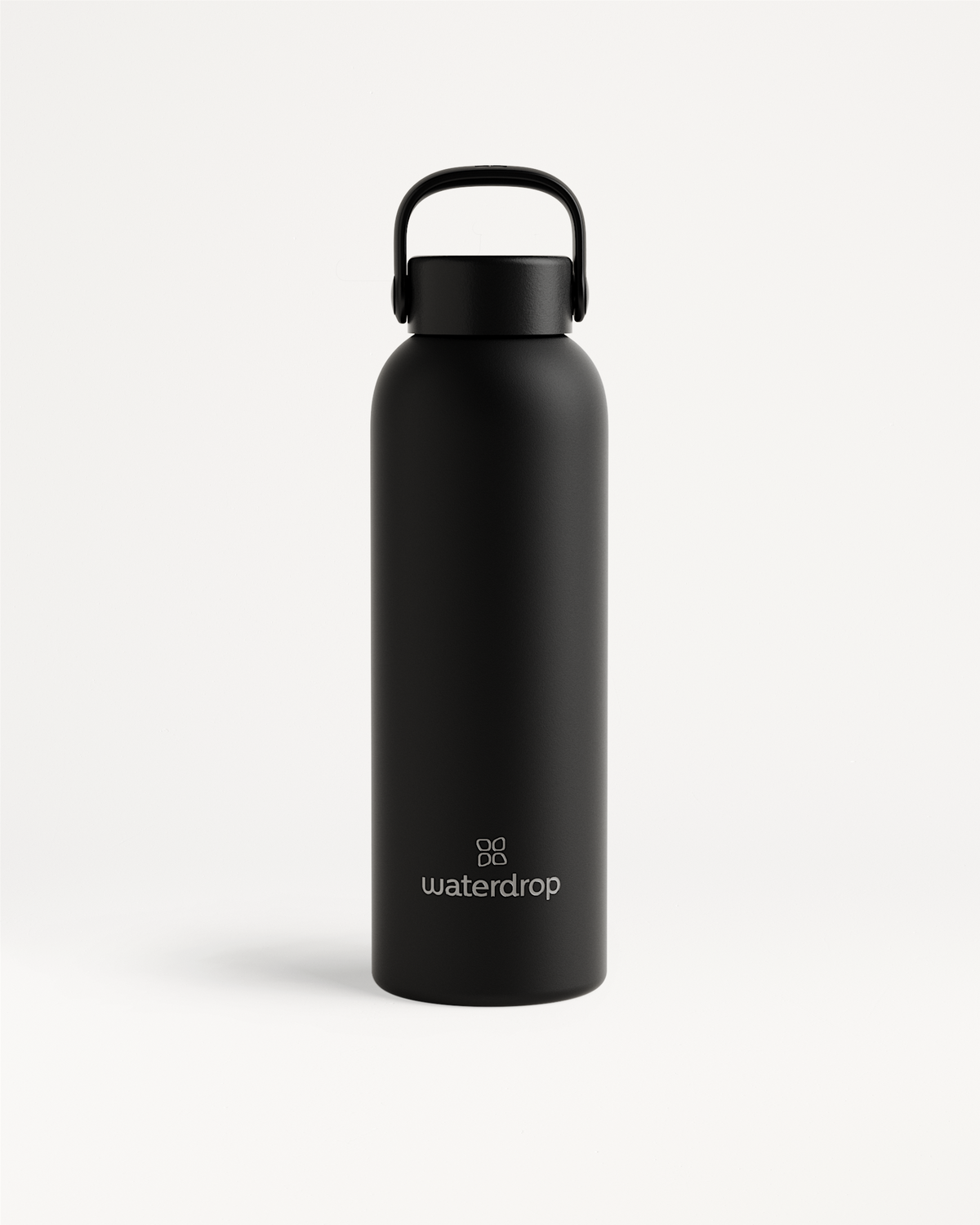 Bouteille Thermo Inox · Bouchon de Transport, matte-black, insulated stainless steel.