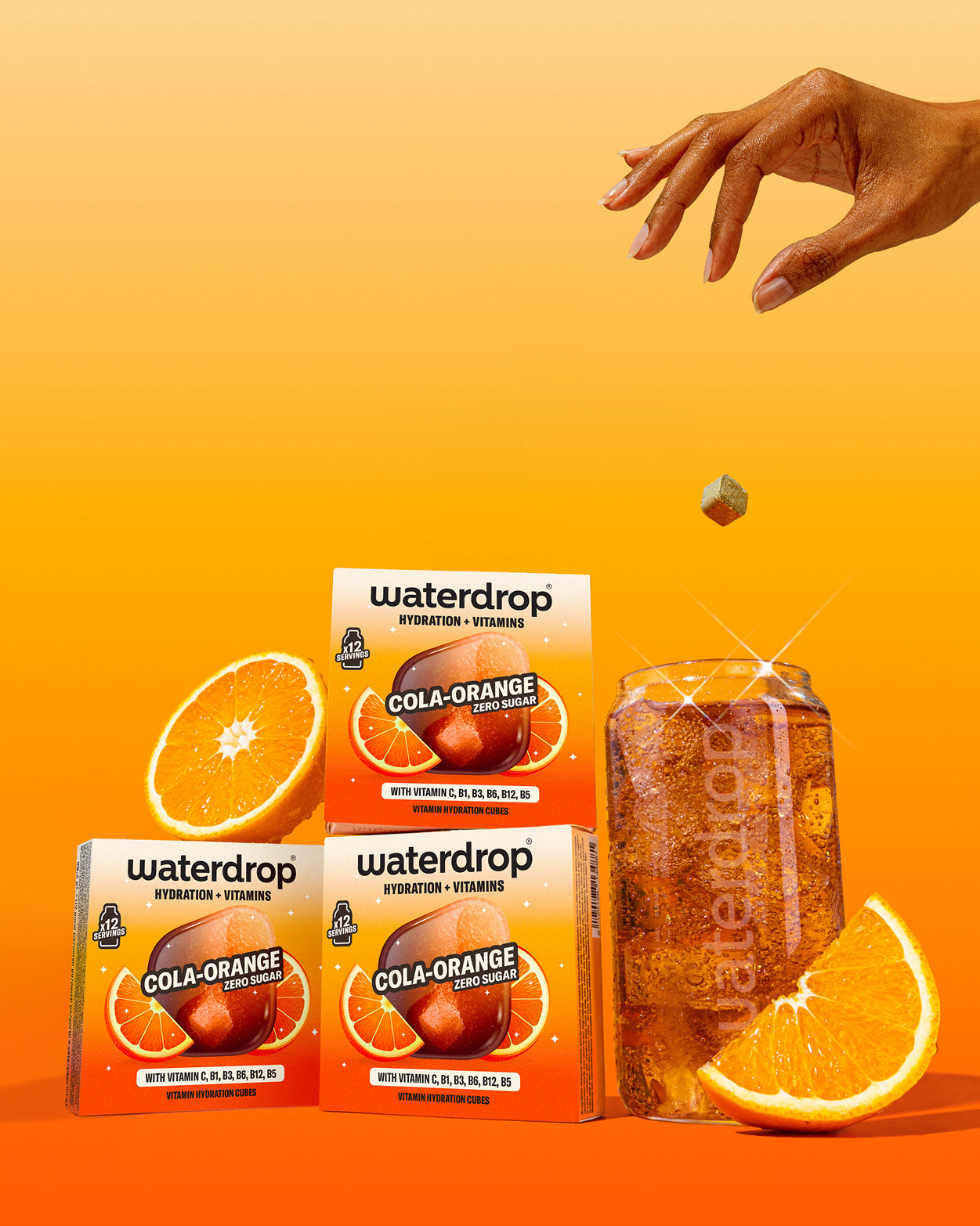 Waterdrop 3+1 COLA ORANGE hydration cubes drop into fizz.