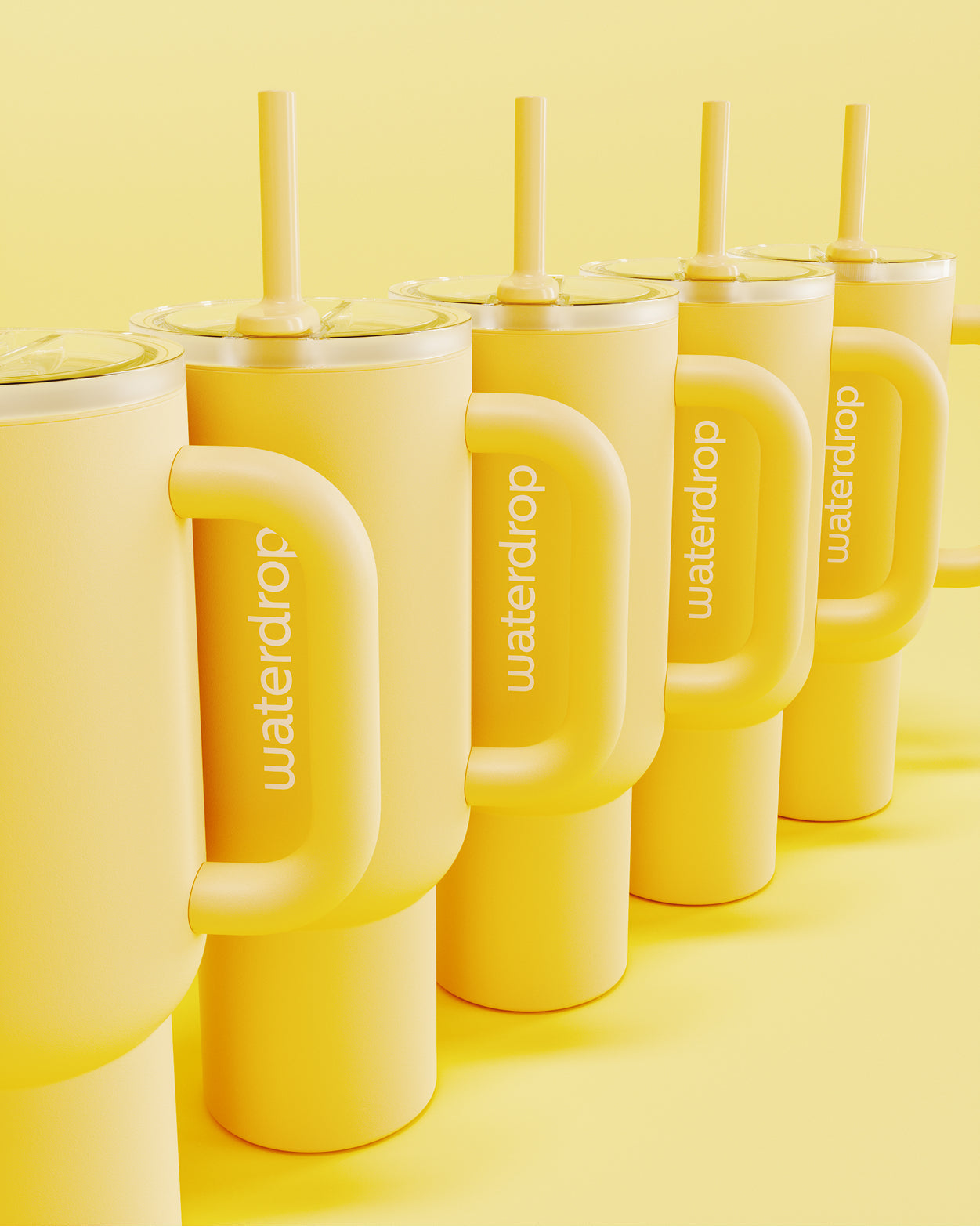 Gobelet Thermo Exploreur jaune beurre with handle and straw.