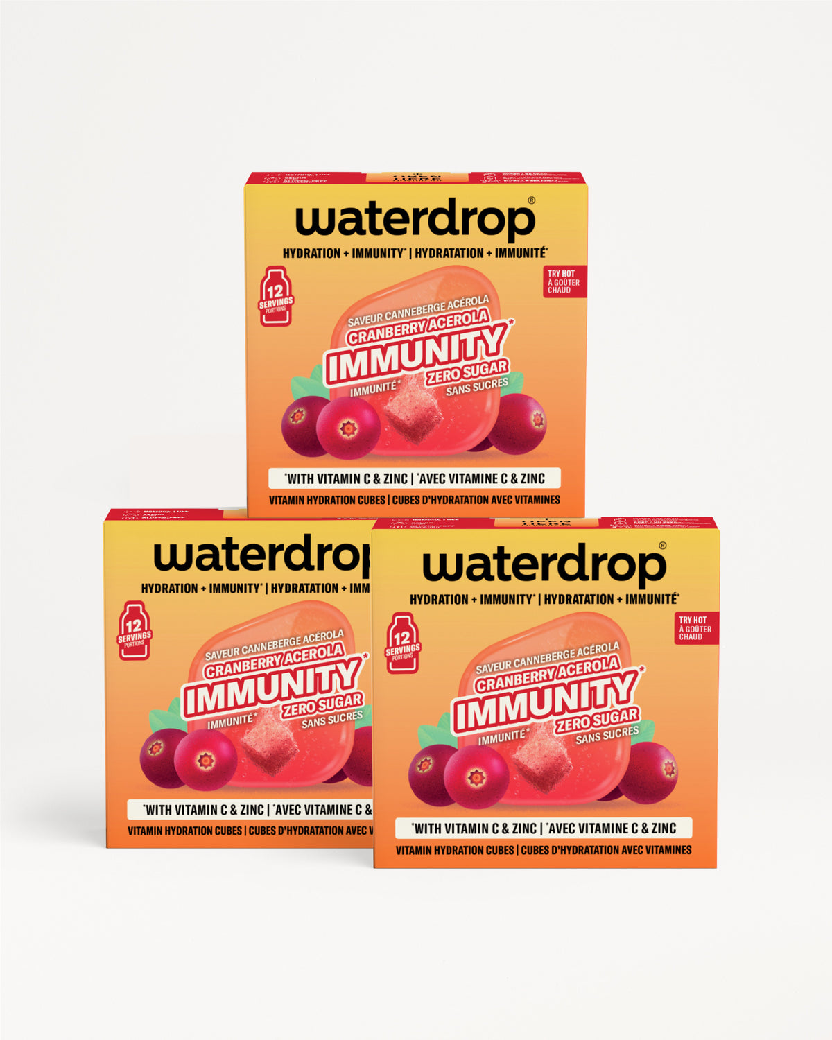 Trois boîtes Waterdrop orange et jaune empilées, avec des illustrations de fruits.