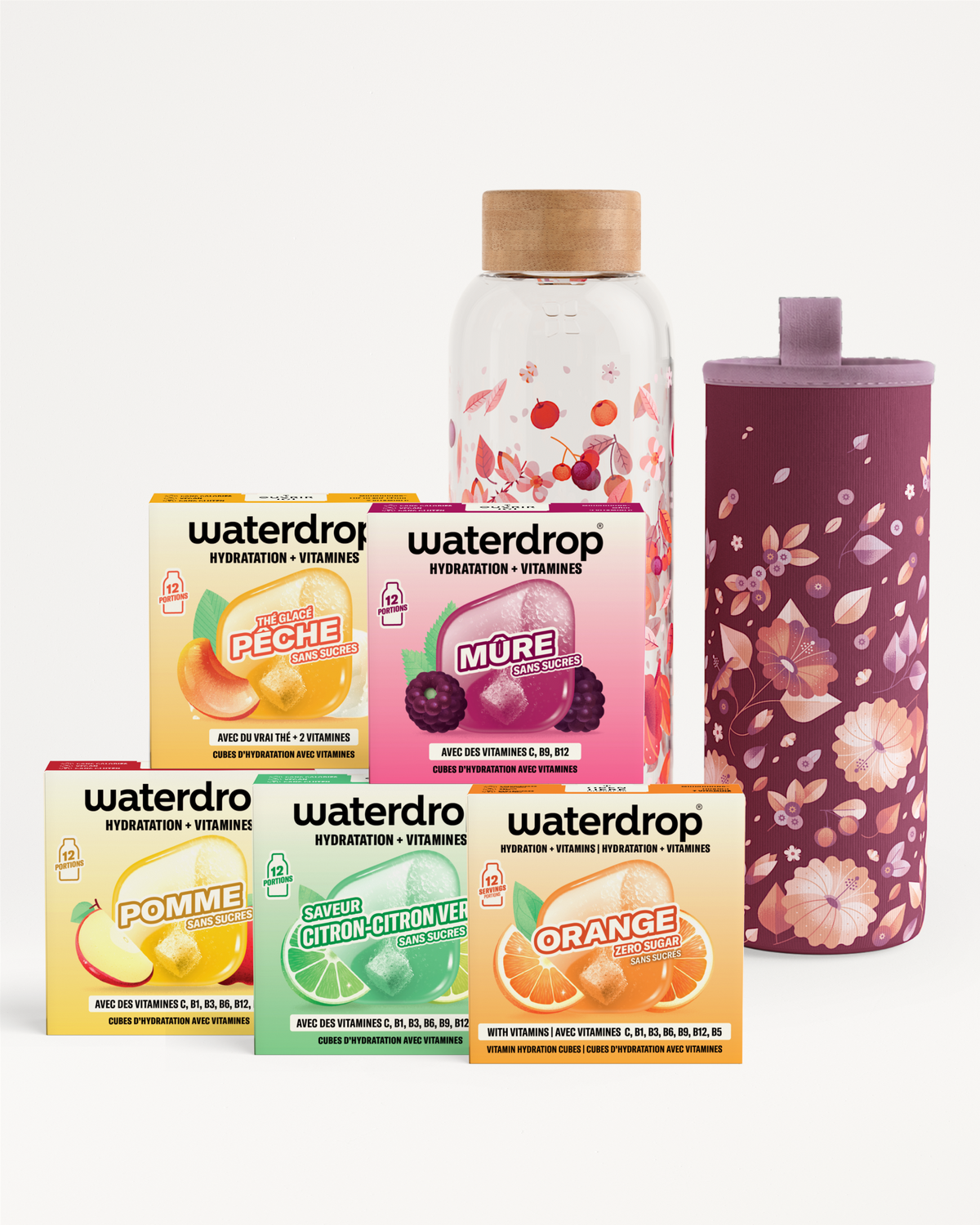 Assortiment de boîtes Waterdrop hydratation vitamines avec une bouteille transparente et bouchon en bois, à côté d'une gourde isolante violette.