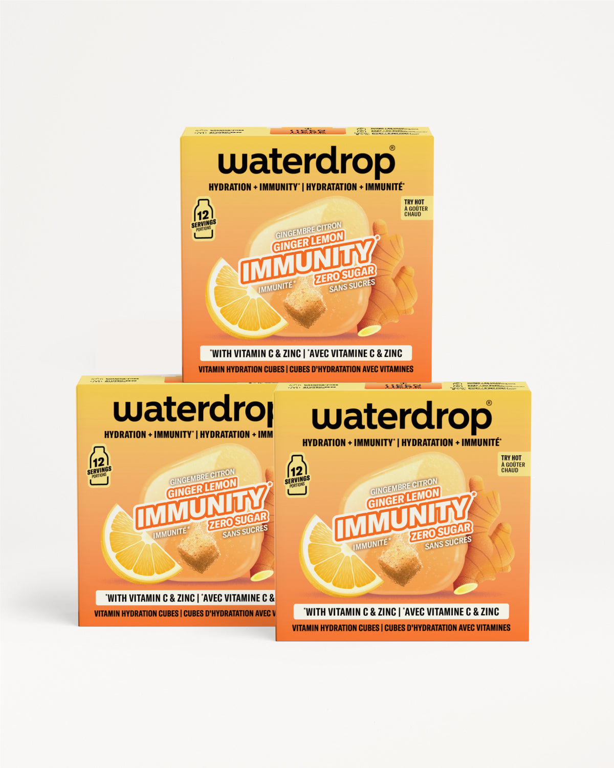 Trois boîtes orange Waterdrop Immunity avec vitamine C et zinc empilées en pyramide.