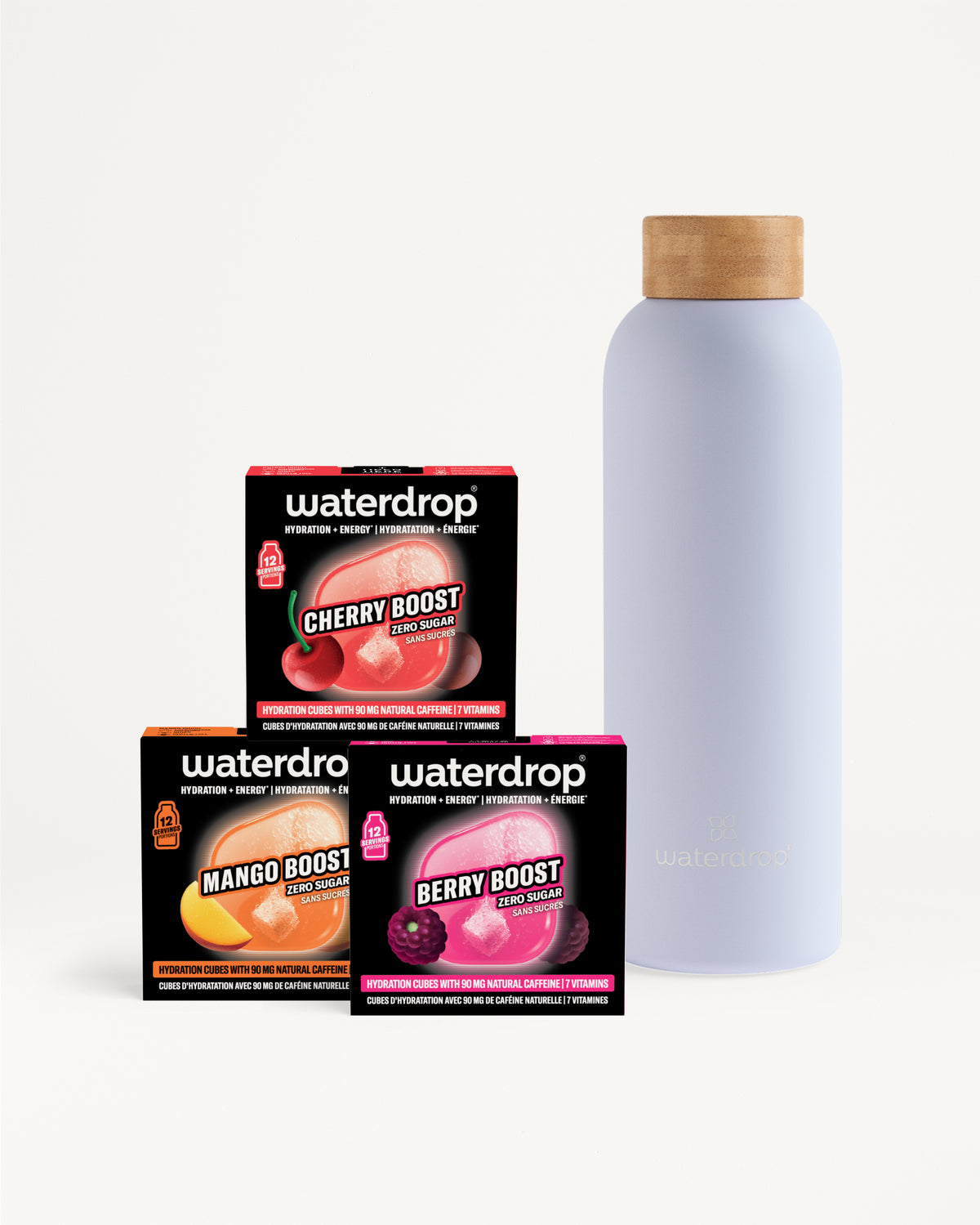 Boîtes Waterdrop assorties empilées à côté d'une grande bouteille violette clair avec bouchon en liège.
